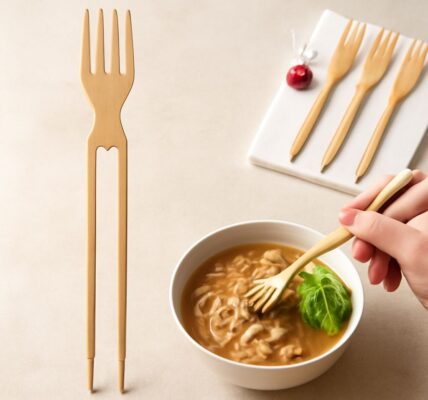 Chopsticks and forks, including red chopsticks and silver chopsticks, on a dining table