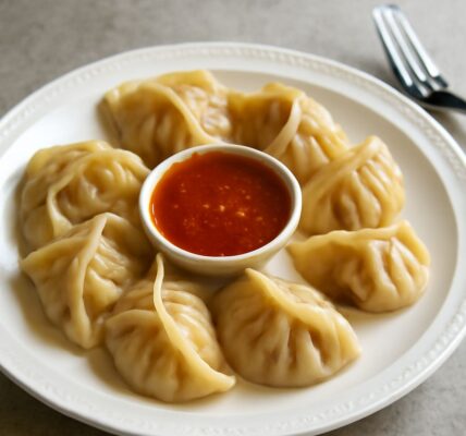 A plate of momo dumplings showcasing the rich flavors of Nepali and Indian food